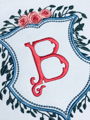 CREST WITH GREENERY AND FLORAL TOP